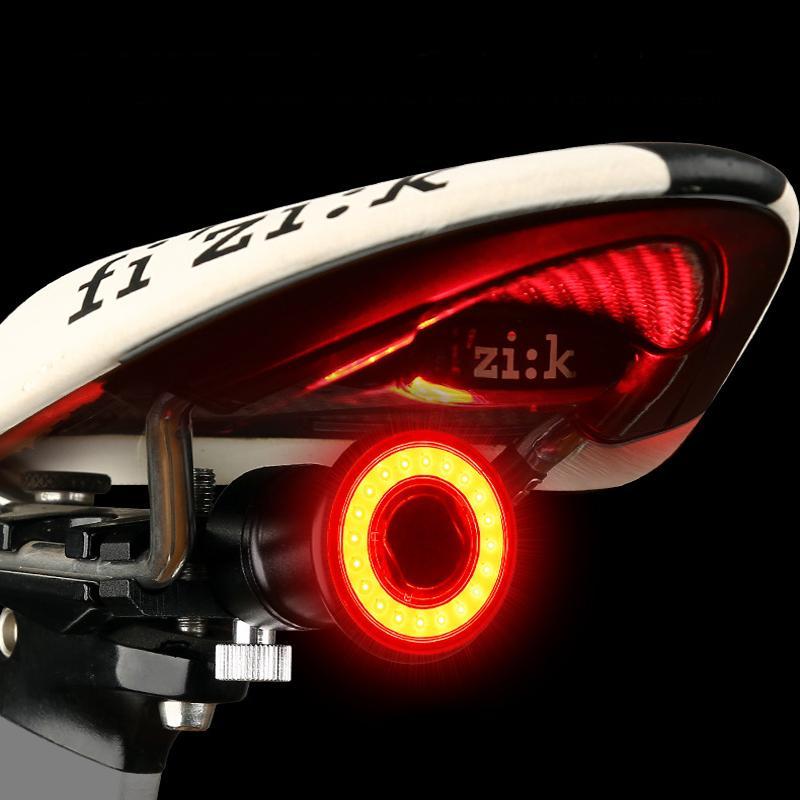 "Rotes, wasserdichtes USB-Fahrradrücklicht mit Aluminiumgehäuse und LED-COB, geeignet für Regenwetter und Sichtbarkeit."