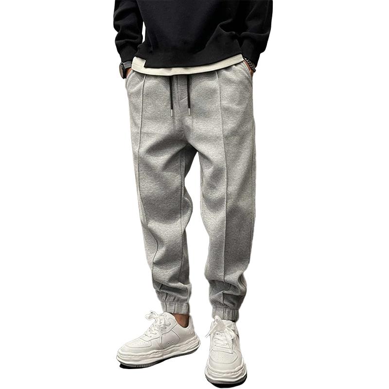 Atmungsaktive Sporthose für Herren, dunkelgrau, mit elastischem Bund, modernes Design, ideal für Sport und Freizeit.