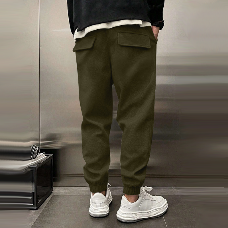Atmungsaktive Sporthose für Herren, dunkelgrau, mit elastischem Bund, modernes Design, ideal für Sport und Freizeit.