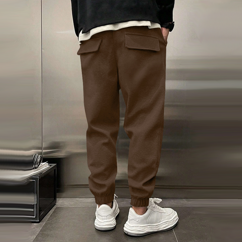 Atmungsaktive Sporthose für Herren, dunkelgrau, mit elastischem Bund, modernes Design, ideal für Sport und Freizeit.