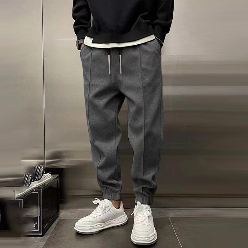 Atmungsaktive Sporthose für Herren, dunkelgrau, mit elastischem Bund, modernes Design, ideal für Sport und Freizeit.