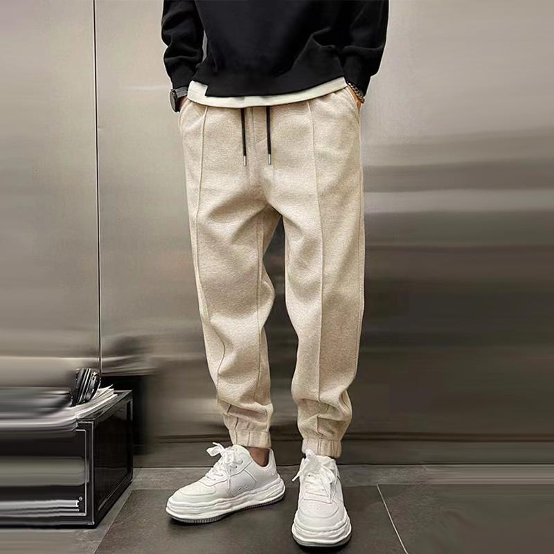 Atmungsaktive Sporthose für Herren, dunkelgrau, mit elastischem Bund, modernes Design, ideal für Sport und Freizeit.