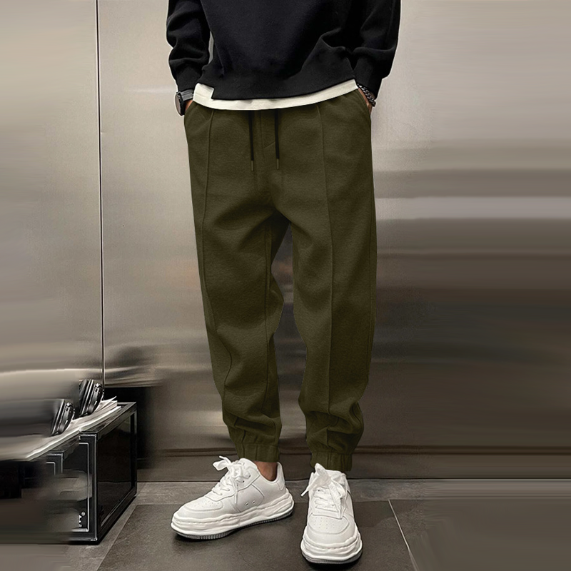 Atmungsaktive Sporthose für Herren, dunkelgrau, mit elastischem Bund, modernes Design, ideal für Sport und Freizeit.
