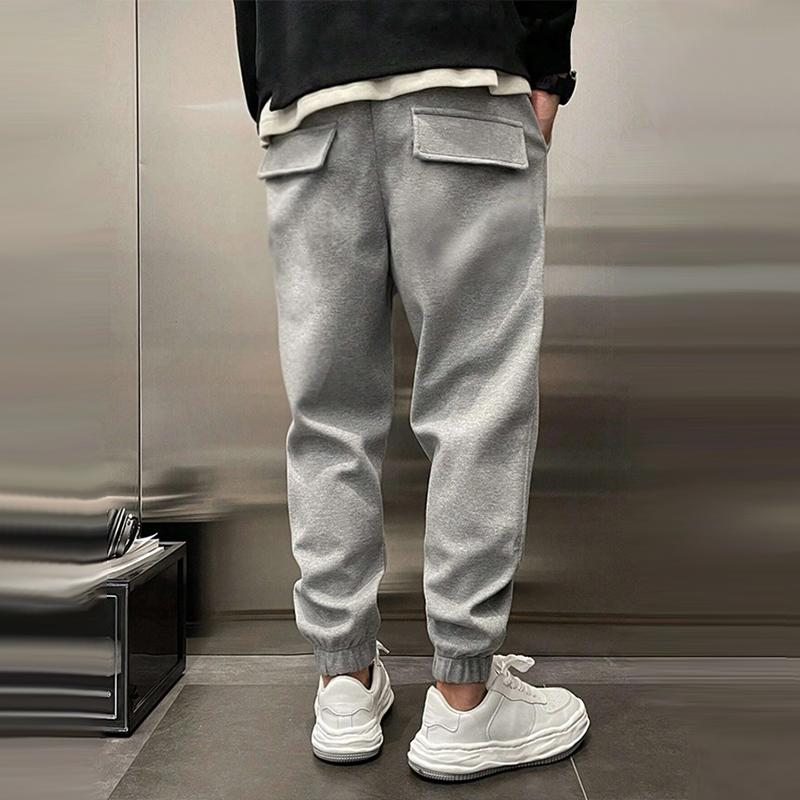 Atmungsaktive Sporthose für Herren, dunkelgrau, mit elastischem Bund, modernes Design, ideal für Sport und Freizeit.