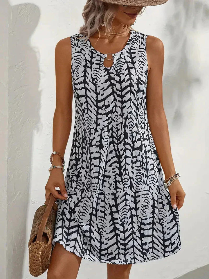 Bedrucktes ärmelloses Sommerkleid für Damen XL-5XL mit blumigem Muster, fließendem Schnitt, ideal für sonnige Tage.
