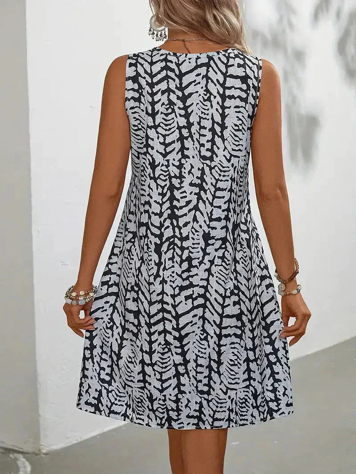 Bedrucktes ärmelloses Sommerkleid für Damen XL-5XL mit blumigem Muster, fließendem Schnitt, ideal für sonnige Tage.