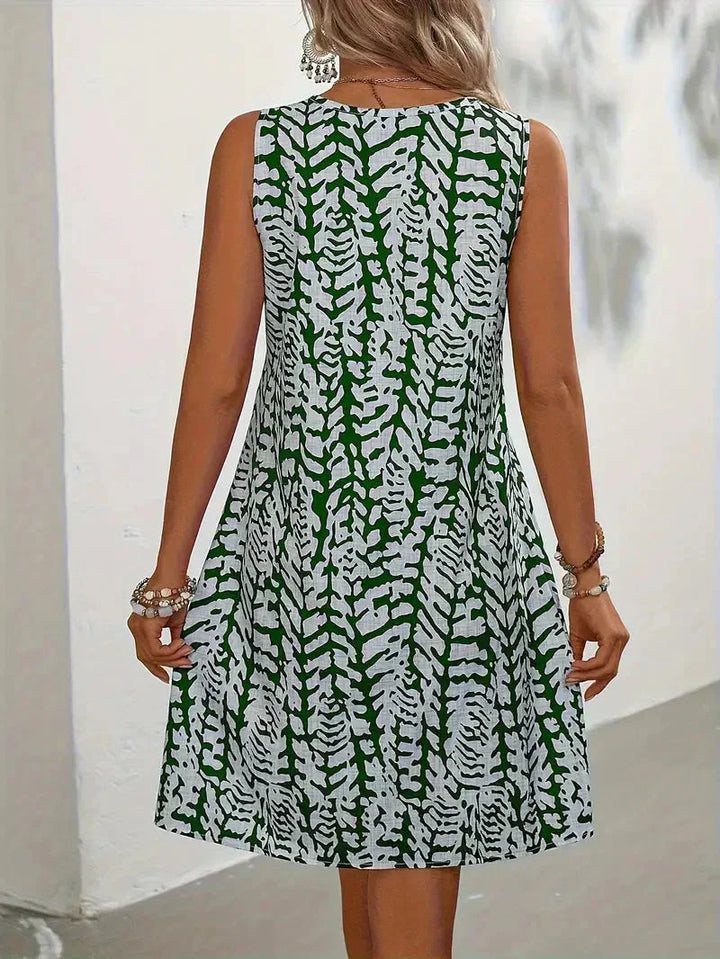 Bedrucktes ärmelloses Sommerkleid für Damen XL-5XL mit blumigem Muster, fließendem Schnitt, ideal für sonnige Tage.
