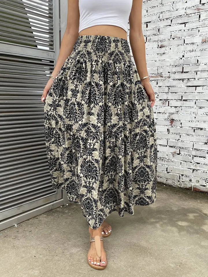 Boho Maxirock Damen, fließend mit Muster und raffinierter Taille, für elegante Looks in Schwarz, Rot oder Braun.