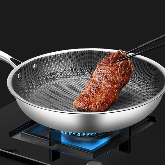 Bratpfanne aus Edelstahl mit Antihaftbeschichtung und Pixel-Technologie, ideal für gleichmäßiges Garen und fettarmes Braten.