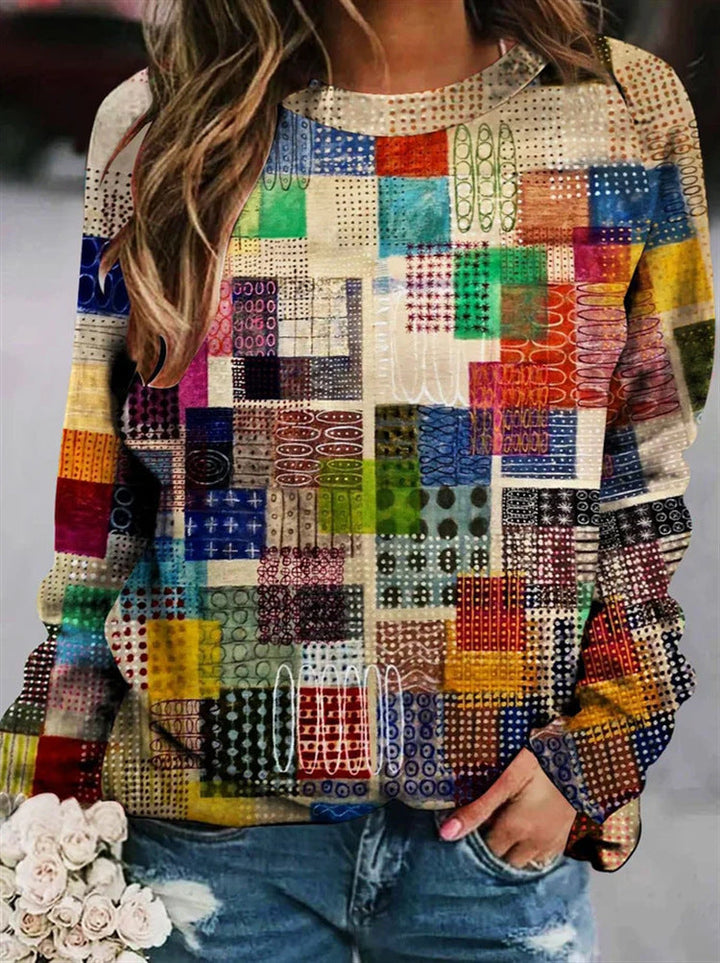 "Bunter Damen-Pullover mit Patchwork und warmen Herbstfarben, lässiger Sitz, lange Ärmel, ideal für gemütliche Tage."