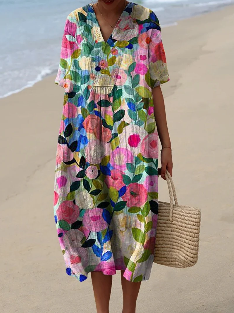 Buntes Sommerkleid mit Blumenmuster, leichte Eleganz, knielang, luftiger Stoff, ideal für warme Tage und sommerliche Events.