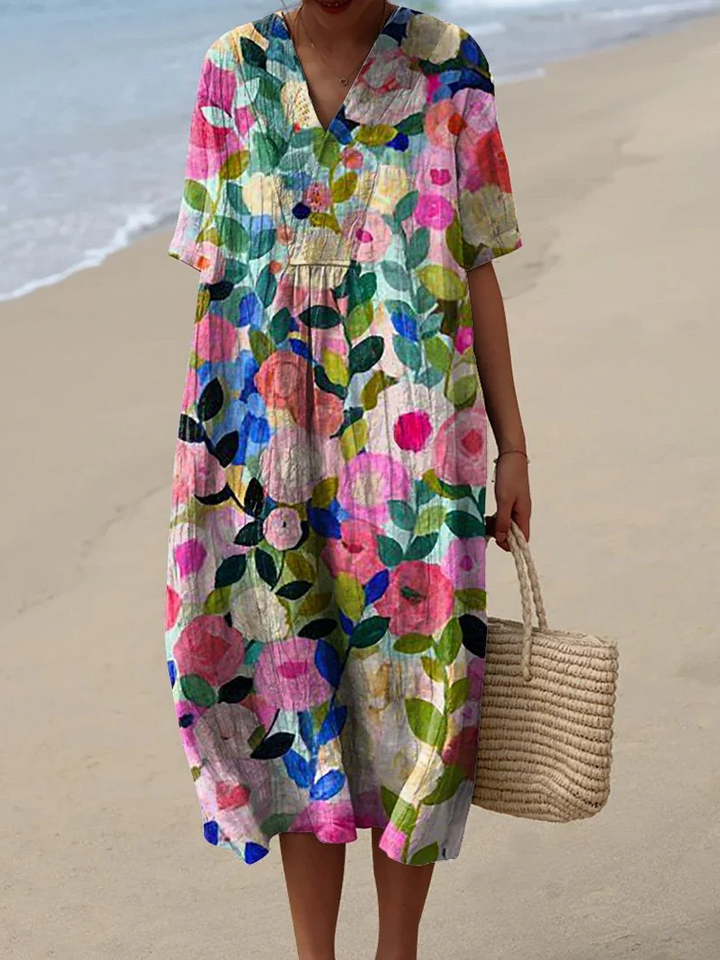 Buntes Sommerkleid mit Blumenmuster, leichte Eleganz, knielang, luftiger Stoff, ideal für warme Tage und sommerliche Events.