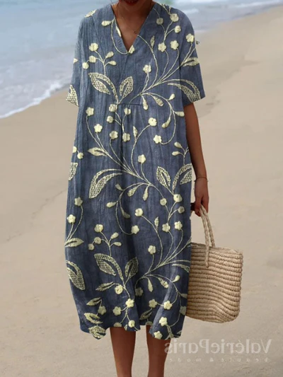 Buntes Sommerkleid mit Blumenmuster, leichte Eleganz, knielang, luftiger Stoff, ideal für warme Tage und sommerliche Events.