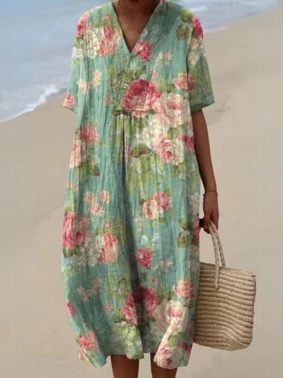 Buntes Sommerkleid mit Blumenmuster, leichte Eleganz, knielang, luftiger Stoff, ideal für warme Tage und sommerliche Events.