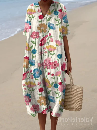 Buntes Sommerkleid mit Blumenmuster, leichte Eleganz, knielang, luftiger Stoff, ideal für warme Tage und sommerliche Events.