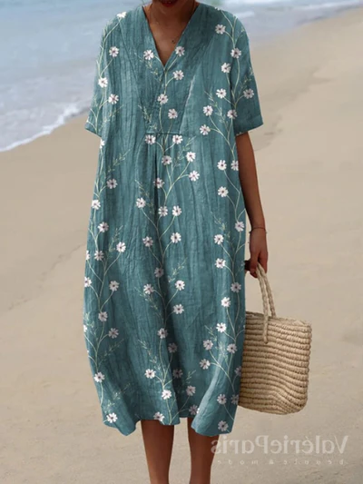 Buntes Sommerkleid mit Blumenmuster, leichte Eleganz, knielang, luftiger Stoff, ideal für warme Tage und sommerliche Events.