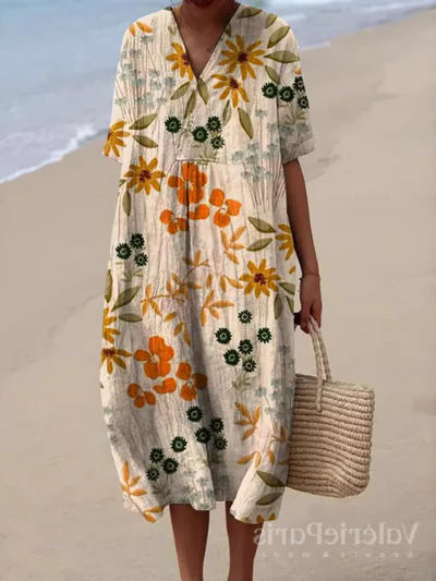 Buntes Sommerkleid mit Blumenmuster, leichte Eleganz, knielang, luftiger Stoff, ideal für warme Tage und sommerliche Events.