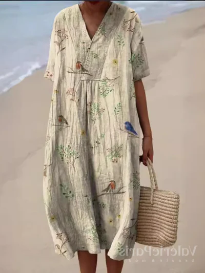 Buntes Sommerkleid mit Blumenmuster, leichte Eleganz, knielang, luftiger Stoff, ideal für warme Tage und sommerliche Events.