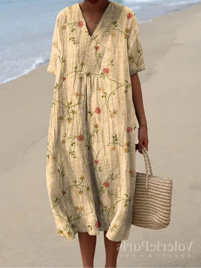 Buntes Sommerkleid mit Blumenmuster, leichte Eleganz, knielang, luftiger Stoff, ideal für warme Tage und sommerliche Events.