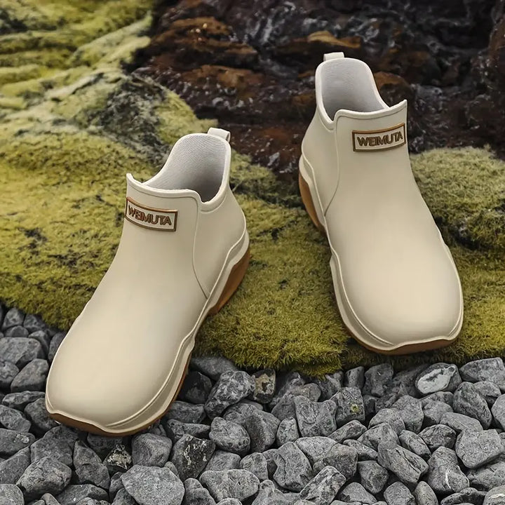 "Damen Gummistiefel: Wasserdicht, elegant, trendig, schwarzes Design, ideal für Regenwetter und Outdoor-Aktivitäten."