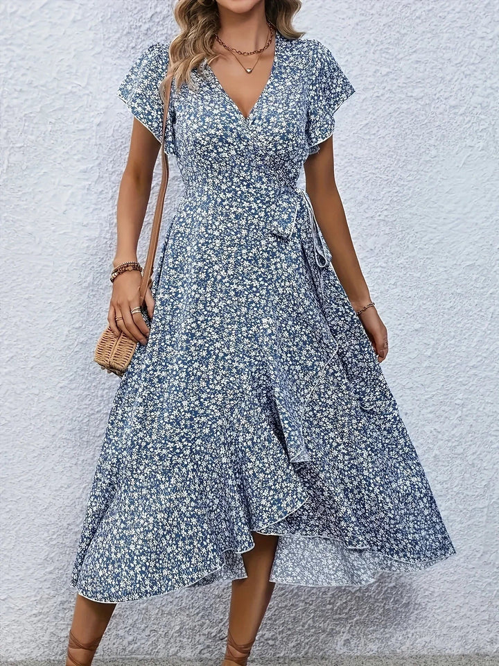 "Damen Midi Kleid mit V-Ausschnitt, florales Design, fließender Stoff, feminin und stilvoll für sonnige Tage."