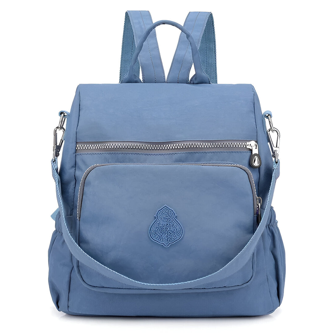 Diebstahlsicherer Damen Rucksack in Beige, wetterfest, elegante Konstruktion, versteckte Reißverschlüsse für Sicherheit.