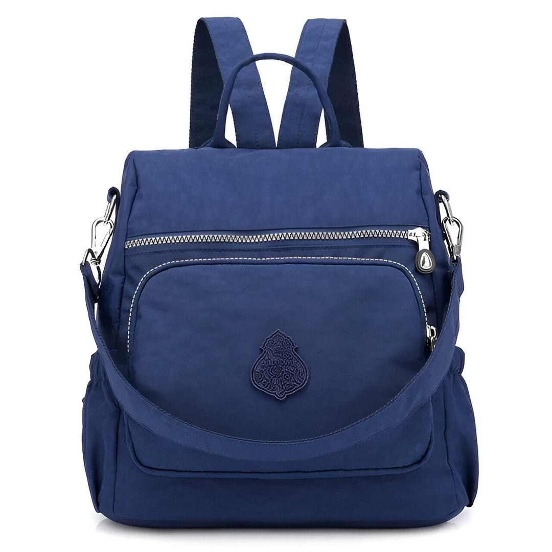 Diebstahlsicherer Damen Rucksack in Beige, wetterfest, elegante Konstruktion, versteckte Reißverschlüsse für Sicherheit.
