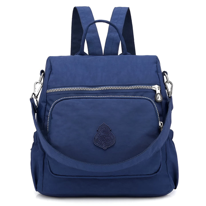 Diebstahlsicherer Damen Rucksack in Beige, wetterfest, elegante Konstruktion, versteckte Reißverschlüsse für Sicherheit.