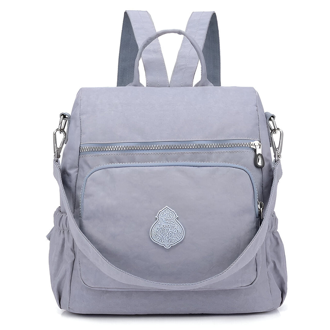 Diebstahlsicherer Damen Rucksack in Beige, wetterfest, elegante Konstruktion, versteckte Reißverschlüsse für Sicherheit.