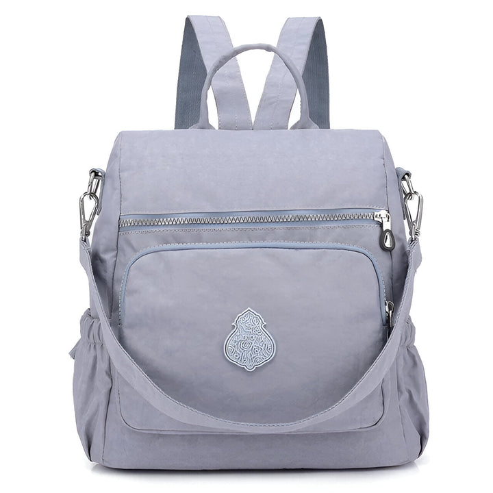 Diebstahlsicherer Damen Rucksack in Beige, wetterfest, elegante Konstruktion, versteckte Reißverschlüsse für Sicherheit.