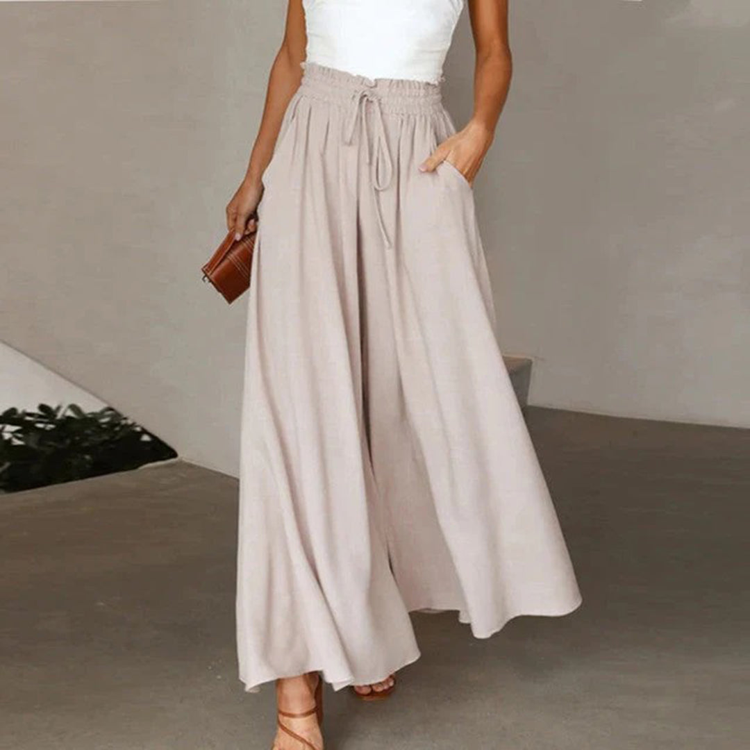 Dunkelblaue elegante Damenhose mit hoher Taille und weiter Passform, ideal für Büro und Abendessen.