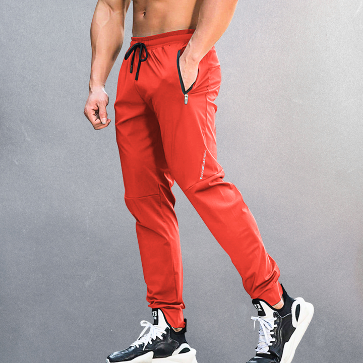 Elastische Herren Sporthose, atmungsaktiv mit Reißverschluss, ideal für Sport und Alltag, in modernem Design.