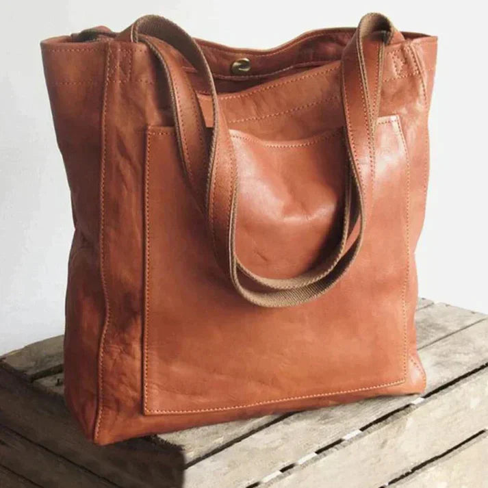 Elegant designte Damen-Umhängetasche aus strapazierfähigem Leder in klassischem Braun für modischen Alltagslook.