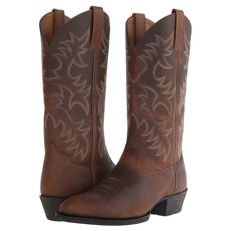 Elegante Cowboy-Stiefel aus hochwertigem Leder mit spitzen Zehenkappen, markanten Nähten; ideal für verschiedene Anlässe.