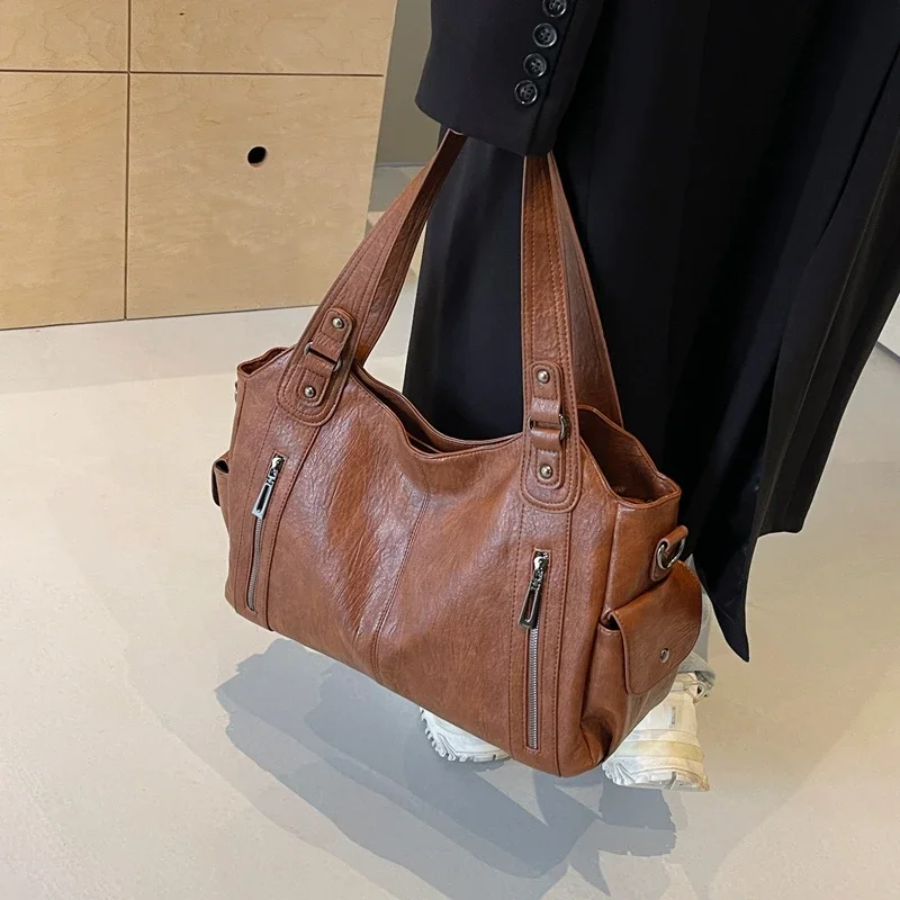 "Elegante Damen-Schultertasche aus hochwertigem Leder mit verstellbarem Gurt und stilvollem, zeitlosem Design."