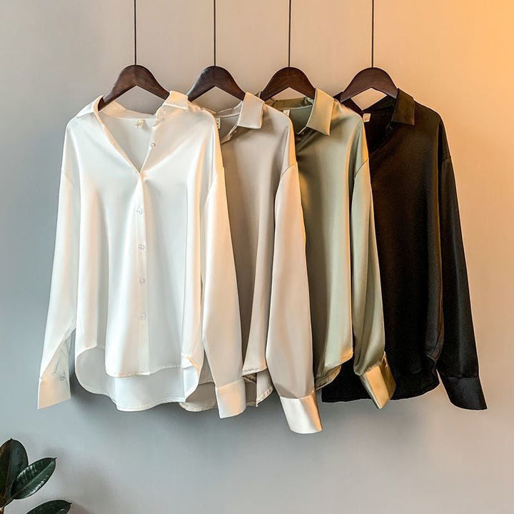 Elegante Damen-Seidenbluse in Beige, figurbetonter Schnitt, luxuriöse Qualität, ideal für Büro und Abendmode.