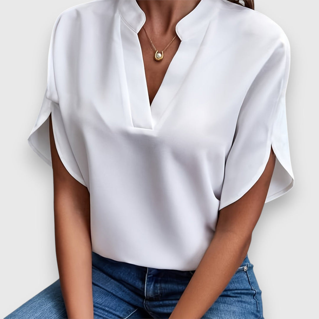 Elegante Damenbluse in Premium-Qualität, weiß mit zeitlosem Design, perfekt für Büro und Dinner, vielseitig kombinierbar.
