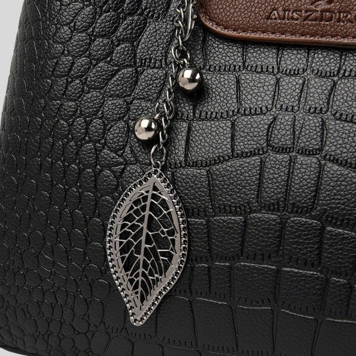 Elegante Damenhandtasche aus Leder mit verstellbarem Gurt, klassische Form, Grün und Schwarz erhältlich.