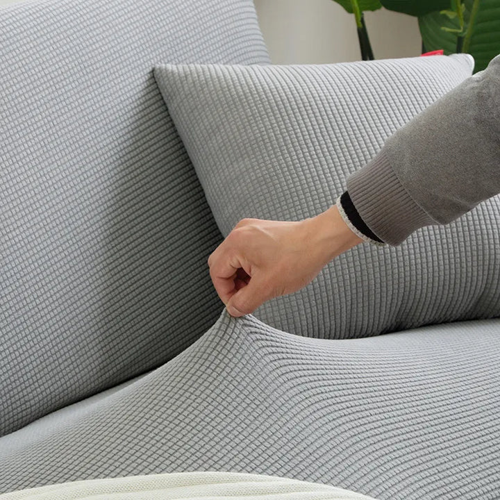 "Elegante elastische Sofahusse in modernem Design, passt perfekt auf verschiedene Sofas, schützt vor Abnutzung und Flecken."