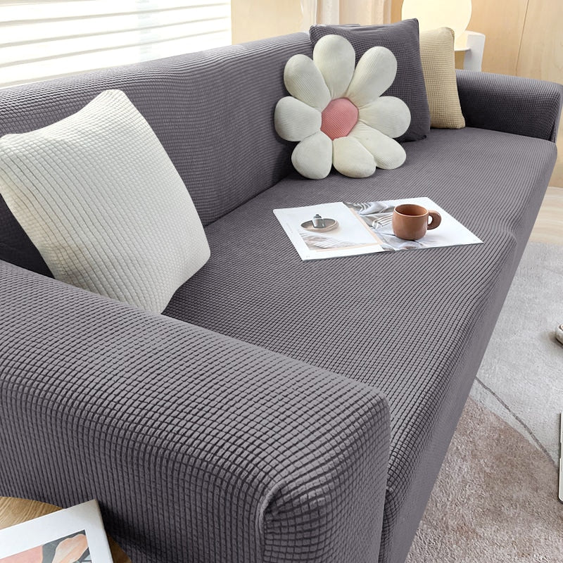 "Elegante elastische Sofahusse in modernem Design, passt perfekt auf verschiedene Sofas, schützt vor Abnutzung und Flecken."