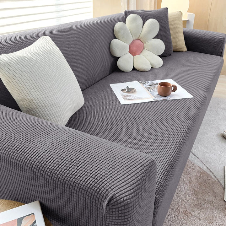 "Elegante elastische Sofahusse in modernem Design, passt perfekt auf verschiedene Sofas, schützt vor Abnutzung und Flecken."