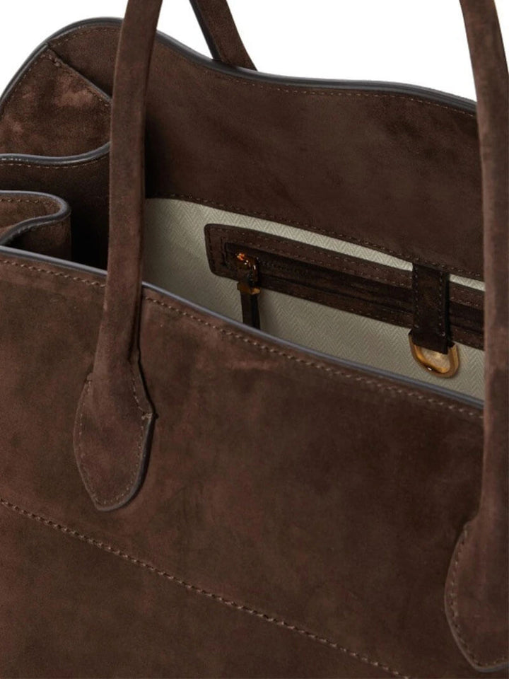"Elegante Großraumtasche aus veganem Leder in sanftem Beige, geräumig und stilvoll für vielseitige Verwendung."