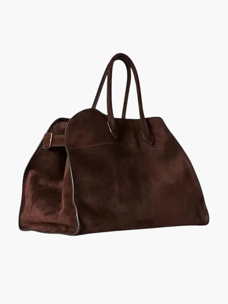 "Elegante Großraumtasche aus veganem Leder in sanftem Beige, geräumig und stilvoll für vielseitige Verwendung."