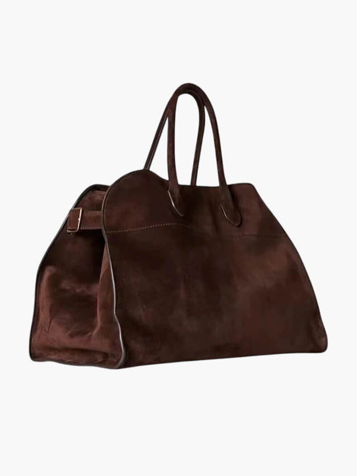 "Elegante Großraumtasche aus veganem Leder in sanftem Beige, geräumig und stilvoll für vielseitige Verwendung."