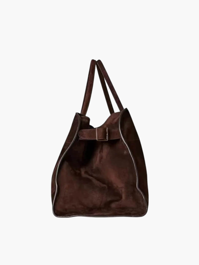 "Elegante Großraumtasche aus veganem Leder in sanftem Beige, geräumig und stilvoll für vielseitige Verwendung."
