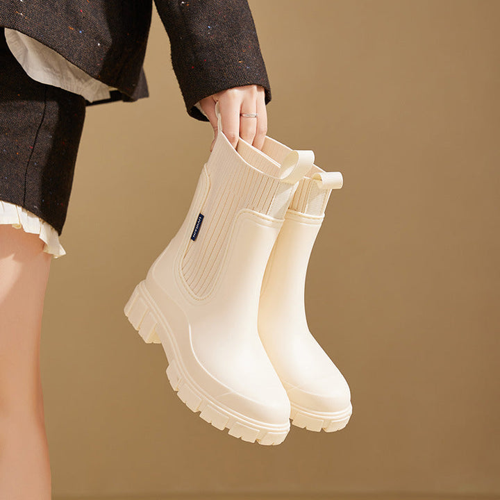 "Elegante Gummistiefel Damen, wasserdichtes Material, rutschfeste Sohle, ideal für Regenwetter, modisch und funktional."