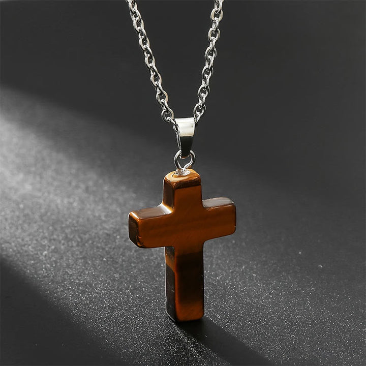 "Elegante Halskette mit Kreuz aus natürlichen Edelsteinen, spiritualer Schmuck symbolisiert Stärke und Schutz."