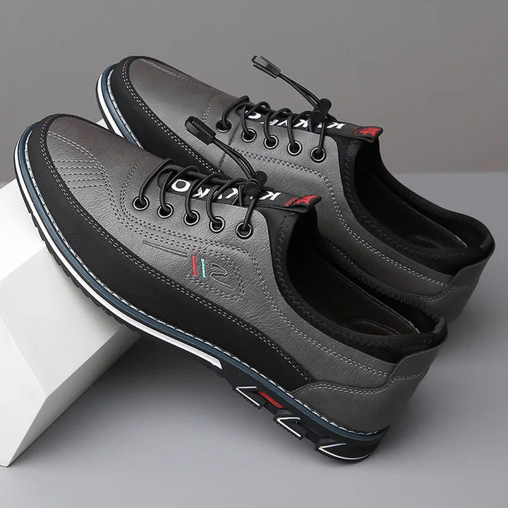 Elegante Herren Oxford-Schuhe, strukturiertes Leder, Schwarz, mit verdecktem Schnürsystem, für stilvolles Business-Outfit.
