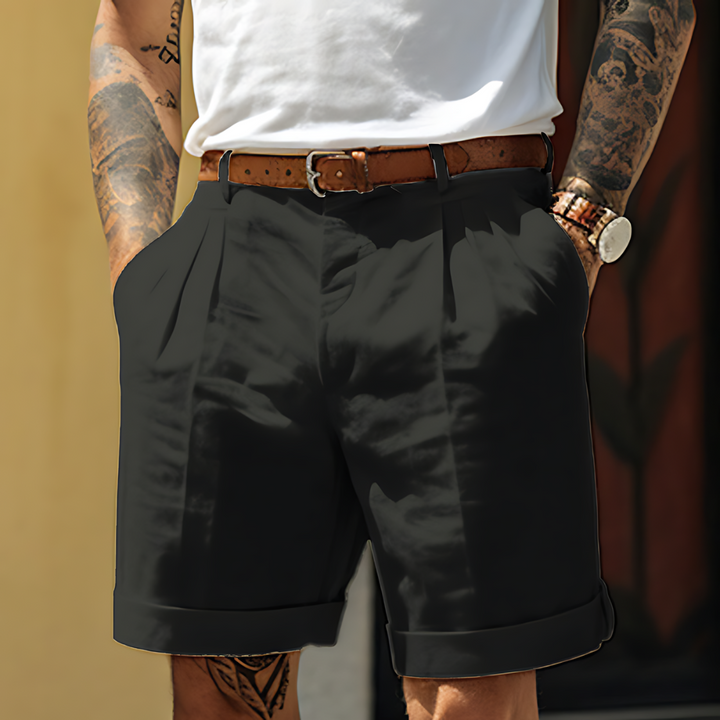 "Elegante Herrenshorts aus Baumwolle, locker geschnitten, mit Knopfleiste und Taschen, ideal für Freizeit und Büro."