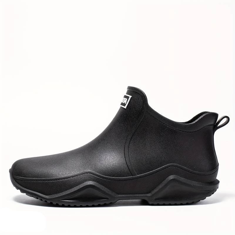 Elegante schwarze orthopädische Gummistiefel für Herren, wasserdicht, ergonomisch, ideal für Komfort und Outdoor-Aktivitäten.